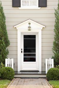 An attractive residence with a white storm door.